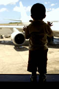 child airport lookingout